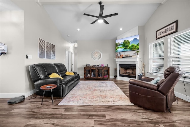 living room featuring high vaulted ceiling, hardwood / wood-style flooring, and ceiling fan