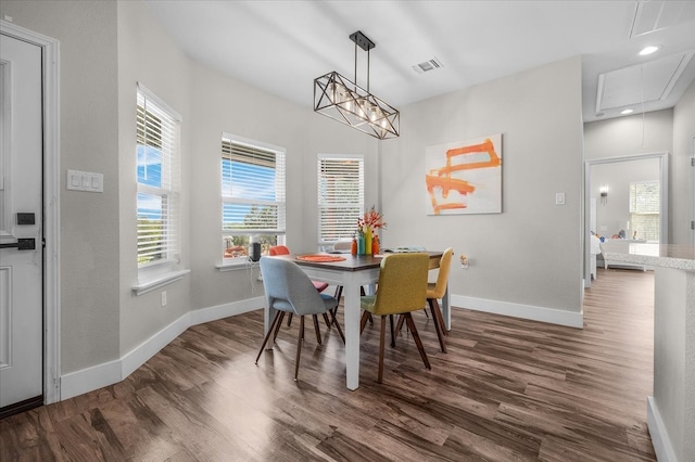 dining room with dark hardwood / wood-style flooring