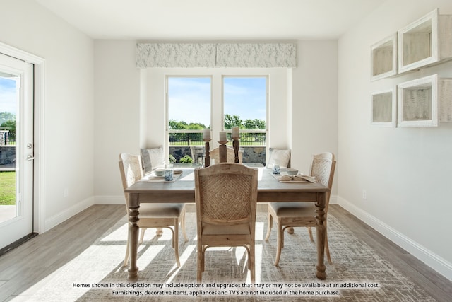 dining area featuring wood-type flooring