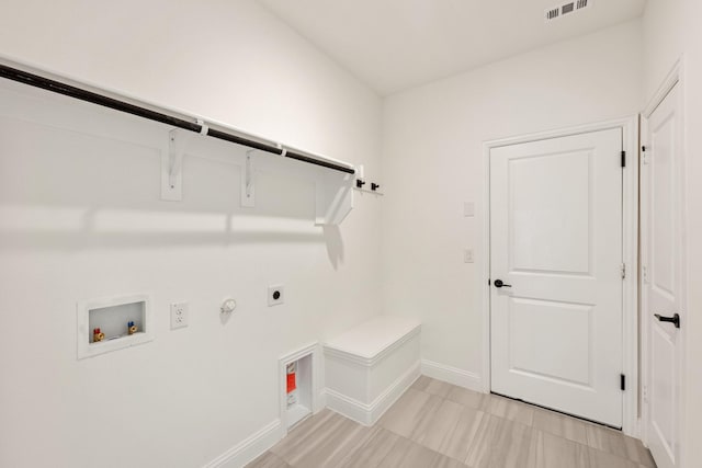 laundry room featuring gas dryer hookup, hookup for a washing machine, laundry area, visible vents, and electric dryer hookup