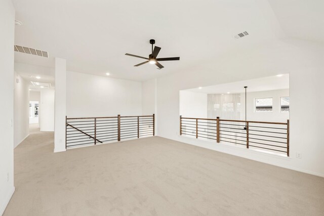 carpeted living room with lofted ceiling and ceiling fan