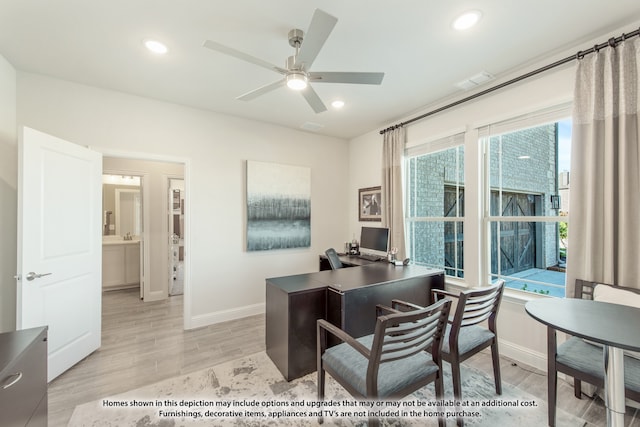 home office featuring ceiling fan and light hardwood / wood-style floors