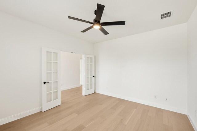 living room with a towering ceiling and light hardwood / wood-style floors