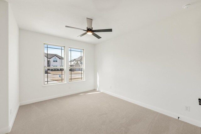 living room featuring a fireplace, a towering ceiling, and light hardwood / wood-style flooring