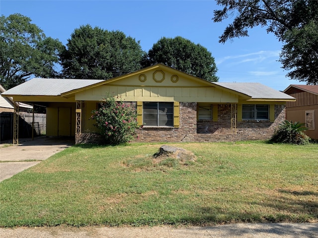 ranch-style home with a front lawn and a carport