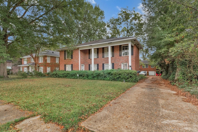 neoclassical / greek revival house with a front yard