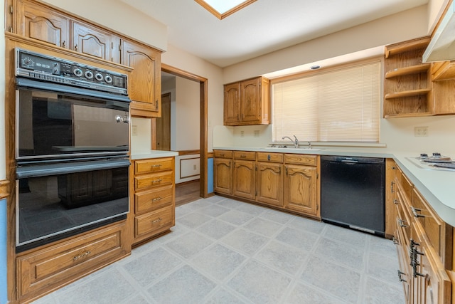 kitchen with sink and black appliances