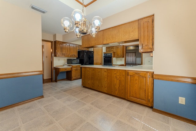 kitchen with kitchen peninsula, hanging light fixtures, black appliances, and a notable chandelier