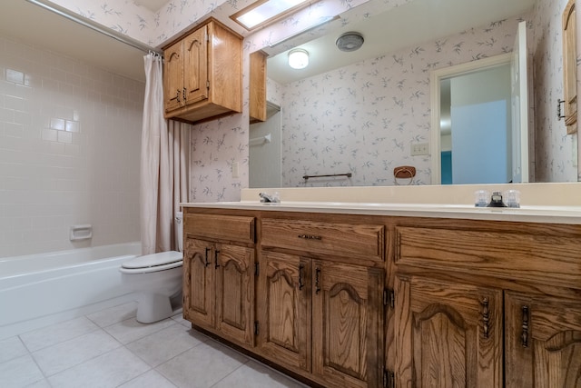 full bathroom featuring tile patterned floors, shower / tub combo with curtain, vanity, and toilet