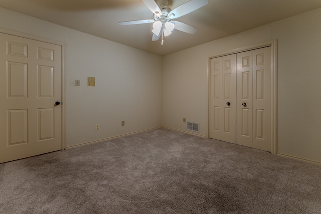 unfurnished bedroom with light carpet, a closet, and ceiling fan