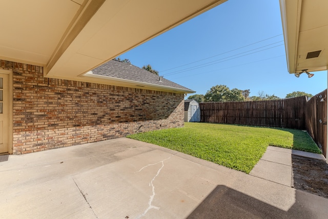 view of patio / terrace featuring a storage shed