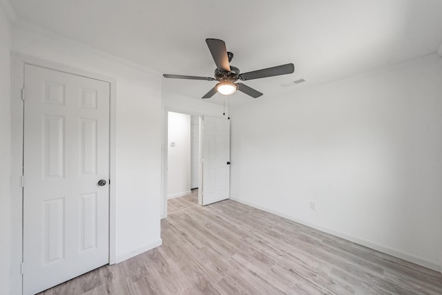 unfurnished bedroom featuring light hardwood / wood-style flooring and ceiling fan