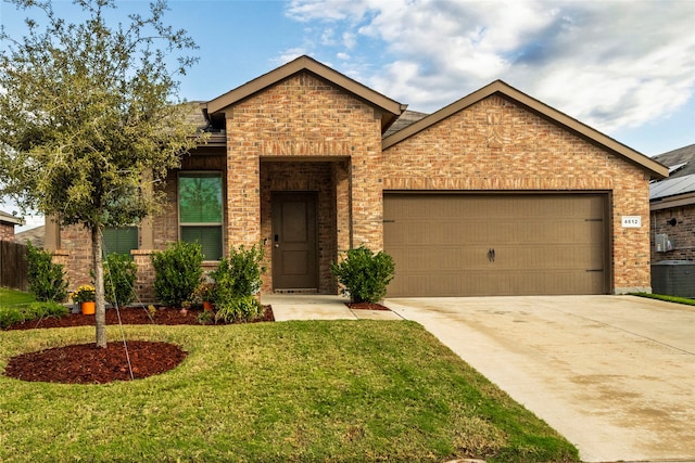 view of front facade with a front yard and a garage