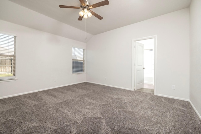 carpeted spare room with lofted ceiling and ceiling fan