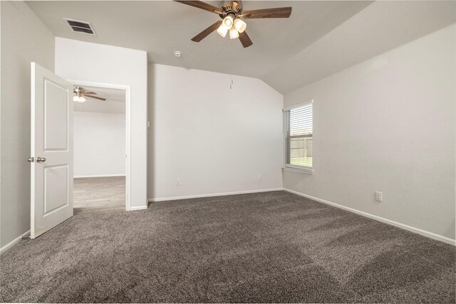 empty room with carpet, vaulted ceiling, and ceiling fan