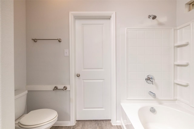 bathroom with toilet and hardwood / wood-style flooring