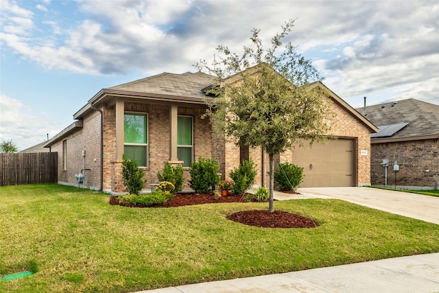 view of front of house featuring a front lawn and a garage