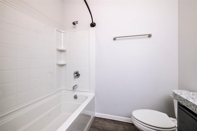 full bathroom with hardwood / wood-style flooring, vanity, bathing tub / shower combination, and toilet