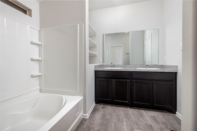 bathroom with vanity, hardwood / wood-style flooring, and shower / bathtub combination