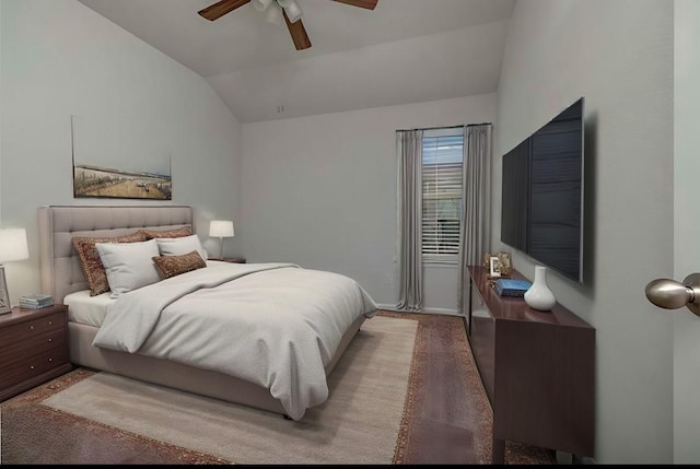 carpeted bedroom featuring ceiling fan and lofted ceiling