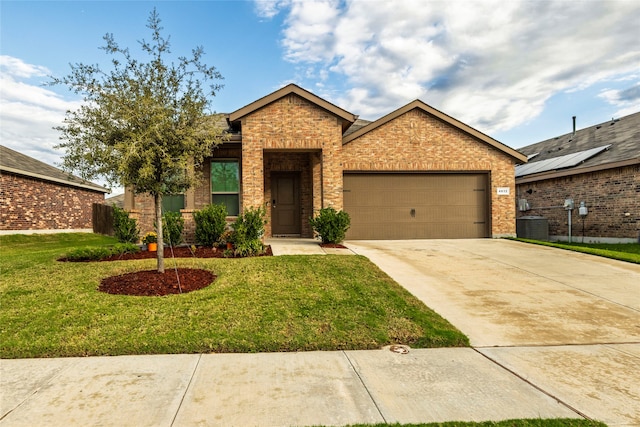 view of front facade featuring a garage and a front yard