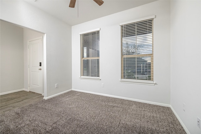 empty room with ceiling fan and carpet