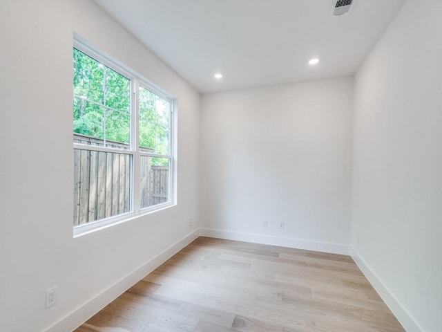 spare room featuring light hardwood / wood-style floors