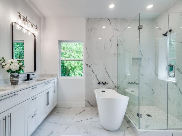 bathroom with vanity and independent shower and bath