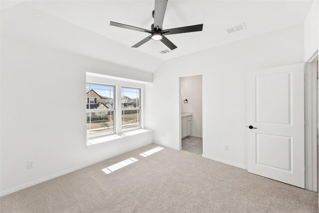 carpeted living room with lofted ceiling