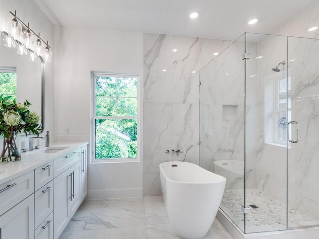 bathroom featuring vanity and plus walk in shower