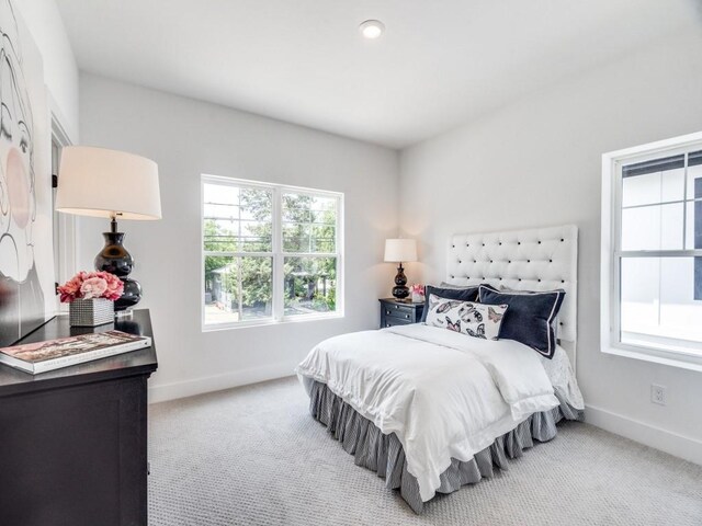 bathroom featuring vanity, shower with separate bathtub, and a wealth of natural light