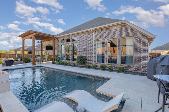 view of swimming pool with a patio, a pergola, and a grill