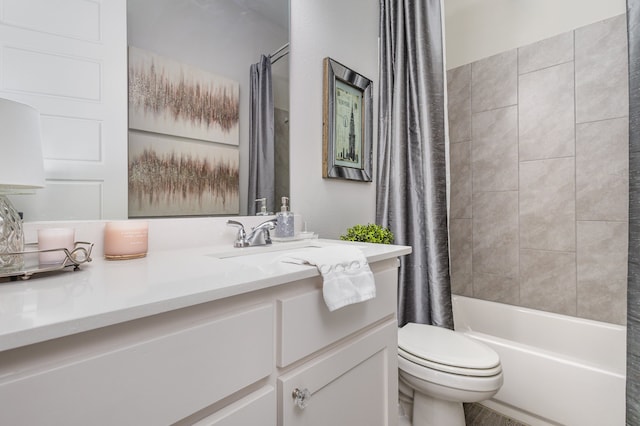 full bathroom with vanity, toilet, and shower / tub combo with curtain