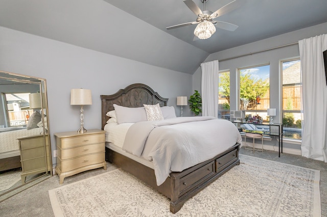 carpeted bedroom featuring vaulted ceiling and ceiling fan