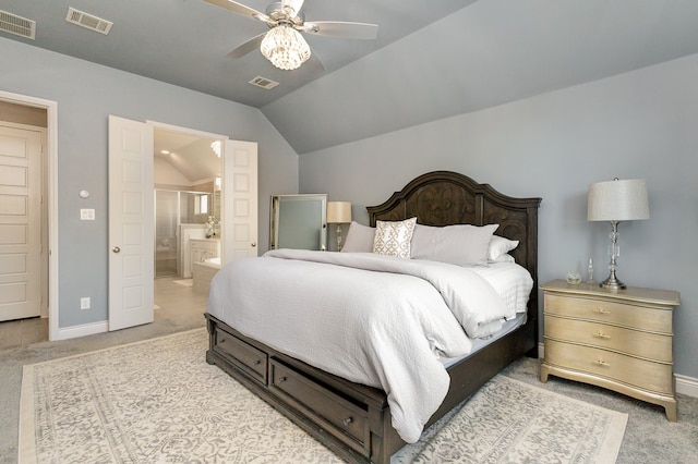 bedroom with light carpet, ensuite bathroom, ceiling fan, and lofted ceiling