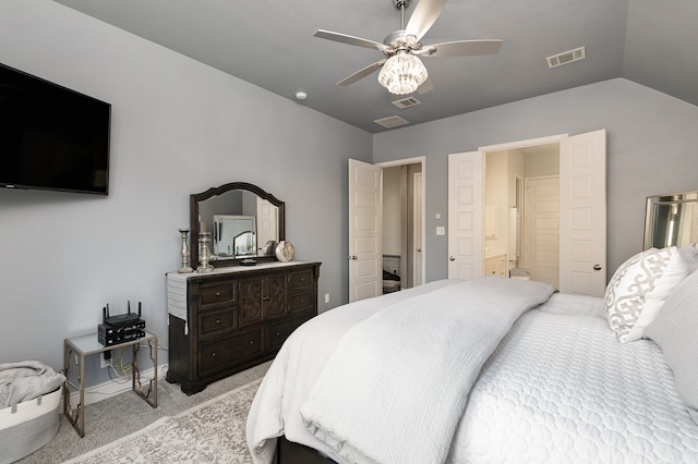 carpeted bedroom featuring ensuite bath, vaulted ceiling, and ceiling fan