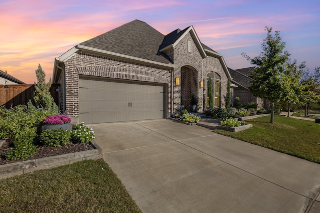 view of front facade with a front yard and a garage