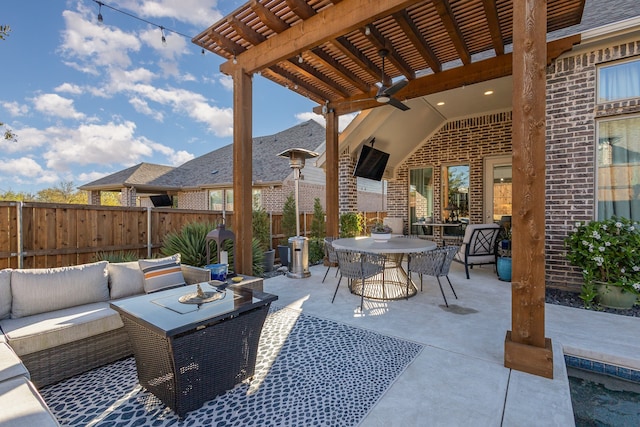 view of patio featuring ceiling fan and an outdoor living space