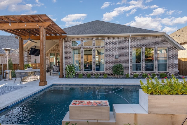 view of swimming pool featuring a pergola and a patio area