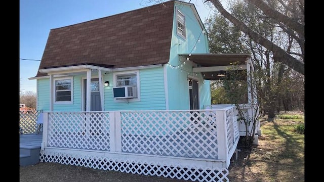 back of house with cooling unit