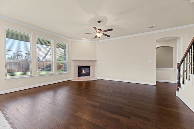 unfurnished living room featuring crown molding, dark hardwood / wood-style flooring, and ceiling fan