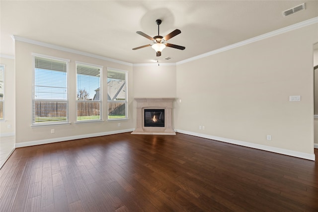 unfurnished living room featuring dark hardwood / wood-style floors, ceiling fan, and ornamental molding