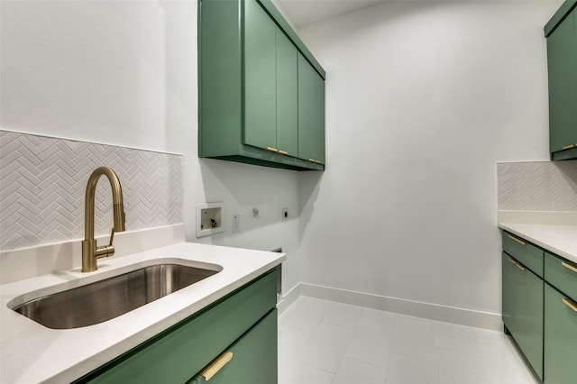 laundry area featuring cabinets, washer hookup, electric dryer hookup, sink, and light tile patterned floors