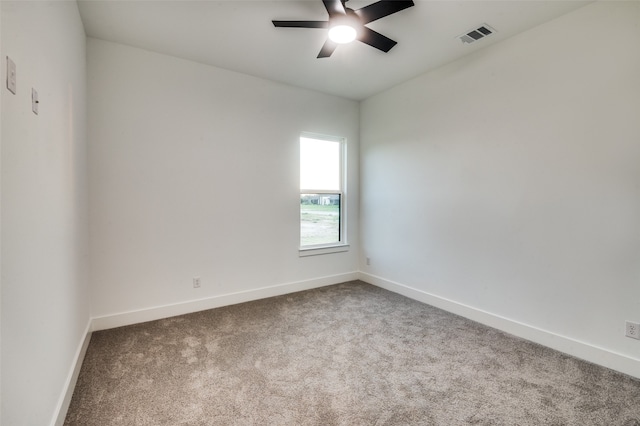 unfurnished room featuring ceiling fan and carpet floors