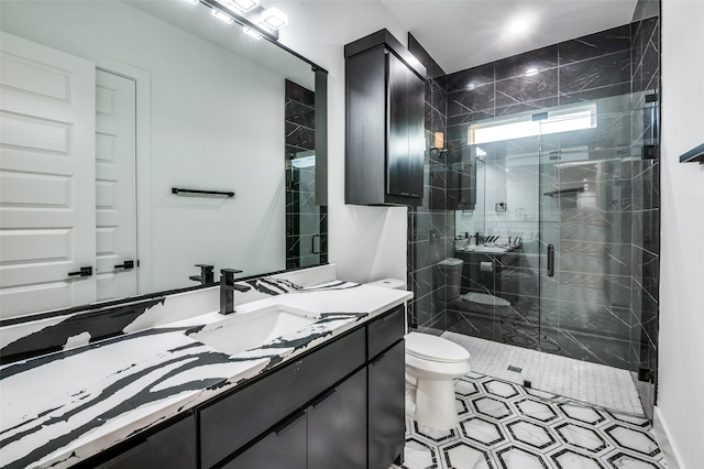 bathroom with vanity, toilet, and walk in shower