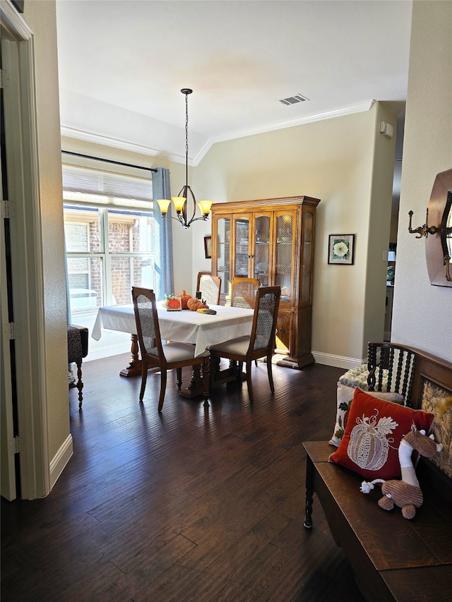 miscellaneous room featuring dark wood-type flooring, crown molding, french doors, and vaulted ceiling