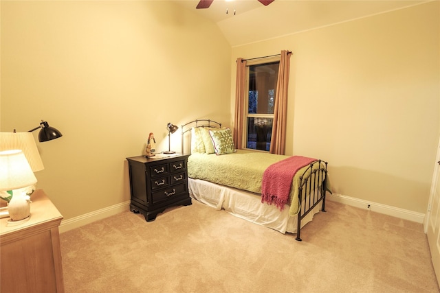 bedroom featuring ceiling fan, lofted ceiling, and light colored carpet