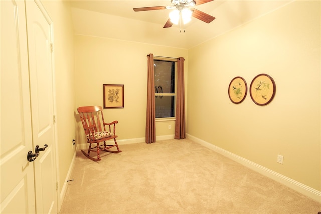 unfurnished room with ceiling fan and light colored carpet