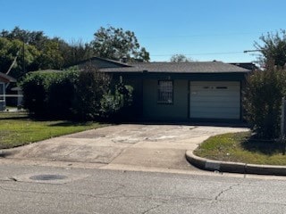 single story home featuring a garage