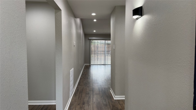 hall with dark hardwood / wood-style flooring